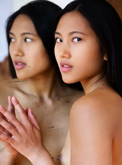 May Thai Shows Her Shaved Pussy With a Smile