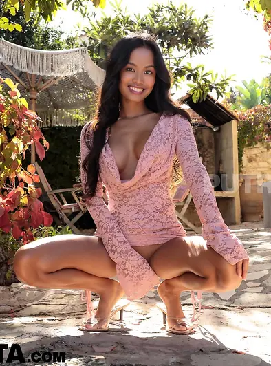 Putri Cinta Smiles As She Poses Nude Outdoors