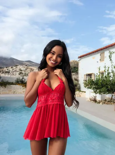 Putri Cinta Teases Topless Poolside In Her Red Dress