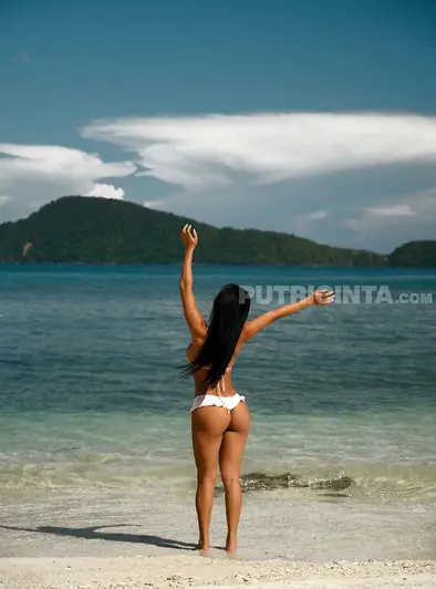 Scarlet Assian Turns Up the Heat on a Tropical Beach