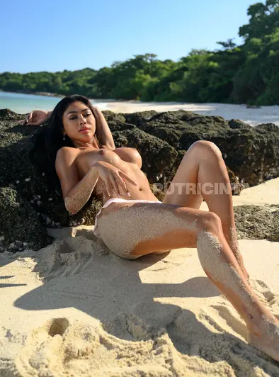 Scarlet Assian Turns Up the Heat on a Tropical Beach