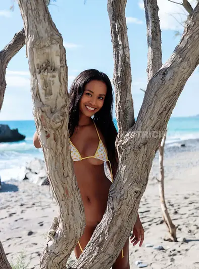 Putri Cinta Soaks Up The Sun Bare
