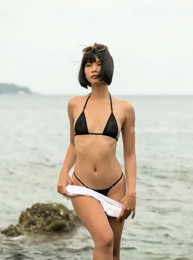 Cara Pin Strips Nude On The Rocky Beach
