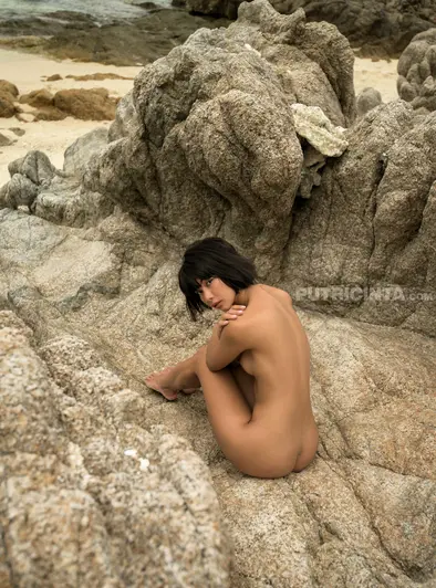 Cara Pin Strips Nude On The Rocky Beach