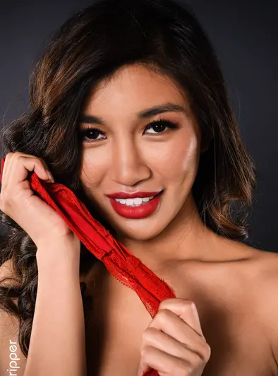 Clara Trinity Smiles While She Strips In Red