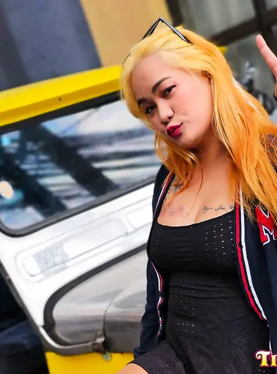 Tattooed Blonde Filipina Gets Down On The Bed