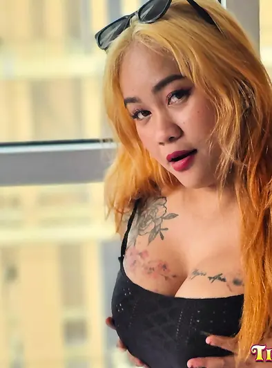 Tattooed Blonde Filipina Gets Down On The Bed